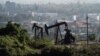 FILE - Active pumpjacks from oil wells are pictured at the Inglewood Oil Field, the largest urban oil field in the United States, from the Baldwin Hills Scenic Overlook in Culver City, California, March 10, 2022. 