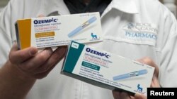 FILE - A pharmacist displays boxes of Ozempic, a semaglutide injection drug used for treating type 2 diabetes and obesity made by Novo Nordisk, at Rock Canyon Pharmacy in Provo, Utah, March 29, 2023. 