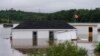 Buildings are seen in floodwater following a major rain event in Halifax, July 22, 2023. Intense thunderstorms dumped record amounts of rain across a wide swath of Nova Scotia.