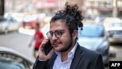FILE - Italian-Egyptian researcher Patrick Zaki arrives at a courthouse in Egypt's northern Nile delta city of Mansoura for a trial hearing on June 21, 2022. 