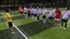Women's soccer coach Kidd Xu, 38, talks to his team, the Netpals, before their friendly amateur game against team Halloween in Beijing, July 15, 2023. 