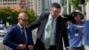 Walt Nauta, left, a valet to former President Donald Trump who is charged with helping the ex-president hide classified documents the Justice Department wanted back, arrives at the James Lawrence King Federal Justice Building in Miami, Thursday, July 6, 2023. 