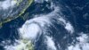 This satellite image taken by Himawari-8, a Japanese weather satellite, and provided by National Institute of Information and Communications Technology, shows Typhoon Doksuri near the northern Philippines, July 25, 2023. 