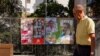 FILE - FILE PHOTO: A man walks past electoral posters ahead of the July 23 snap election, in Ronda, Spain, July 7, 2023. 