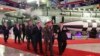 In this photo provided by the North Korean government, North Korean leader Kim Jong Un, right, with a Russian delegation led by its Defense Minister Sergei Shoigu visits an arms exhibition in Pyongyang, North Korea, July 26, 2023.