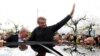 Brazil's former President Jair Bolsonaro waves as he greets supporters at Salgado Filho International Airport, on the day the Electoral Justice begins the trial to determine his political rights, as he arrives in Porto Alegre, Rio Grande do Sul, Brazil, June 22, 2023.