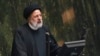 FILE - Iranian President Ebrahim Raisi addresses lawmakers at the parliament in Tehran, Iran, Jan. 22, 2023. 