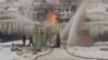 Petugas pemadam kebakaran berusaha memadamkan api di terminal milik Novatek di Pelabuhan Ust-Luga, Rusia, 21 Januari 2024. (Foto: Head of Administration of Kingiseppsky District of Leningrad Region Yuri Zapalatsky Telegram channel via REUTERS)