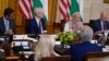 India's Prime Minister Narendra Modi speaks during a meeting with President Joe Biden and U.S. and Indian business leaders at the White House, June 23, 2023, in Washington. At left are Sundar Pichai, CEO of Google, and Tim Cook, CEO of Apple. 