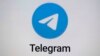 FILE - The logo for the Telegram messaging app is seen on a notebook screen in Munich, Oct. 17, 2022.
