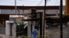 A forensic technician works at a scene where a man threw a Molotov cocktail bomb at a bar after being kicked out, according police, in San Luis Rio Colorado, Mexico July 22, 2023.