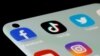FILE - Facebook, TikTok, Twitter, YouTube and Instagram apps are seen on a smartphone in this illustration taken, July 13, 2021.