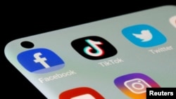 FILE - Facebook, TikTok, Twitter, YouTube and Instagram apps are seen on a smartphone in this illustration taken, July 13, 2021.