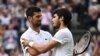 Spain's Carlos Alcaraz acknowledges Serbia's Novak Djokovic after winning the final Wimbledon math, July 16, 2023.