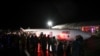Para pengunjung berkumpul di sekitar replika roket di Bandara Cornwall Newquay untuk menyaksikan peluncuran pertama roket LauncherOne milik Virgin Orbit dari Spaceport Cornwall di Newquay, Inggris, 9 Januari 2023.