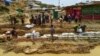 Rohingya refugees make a drainage canal in preparation for the upcoming monsoon season in Kutupalong refugee camp in Ukhia, Bangladesh, May 8, 2018.