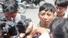 Pa Nguon Teang, founder and executive director of the Cambodian Center for Independent Media (CCIM), talks to reporters in front of Phnom Penh Municipal Court, Phnom Penh, Cambodia, Thursday, August 18, 2016. (Leng Len/VOA Khmer)