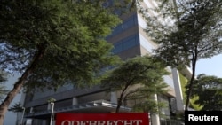 FILE - The corporate logo of the Odebrecht SA construction conglomerate is seen at its headquarters in Sao Paulo, Brazil, July 29, 2019.