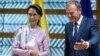 State Counselor of Myanmar Aung San Suu Kyi, left, is greeted by European Council President Donald Tusk at the Europa building in Brussels on May 2, 2017.
