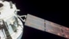 Pesawat ruang angkasa Orion NASA terlihat berada ke belakang Bumi dari kamera yang dipasang di salah satu panel surya. (Foto: NASA via AP)
