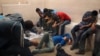Immigrants, who have been caught crossing the border illegally, are housed inside the McAllen Border Patrol Station in McAllen, Texas where they are processed, July 15, 2014. 