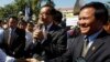 FILE PHOTO - Opposition leader of Cambodia National Rescue Party Sam Rainsy, center, delivers a speech next to his Deputy President Kem Sokha, right, during a gathering to mark Human Rights Day, in front of National Assembly, in Phnom Penh, Cambodia, Wednesday, Dec. 10, 2014. (AP Photo/Heng Sinith)