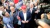 FILE - Republican presidential candidate Donald Trump, center, greets supporters in Los Angeles, Sept. 15, 2015.