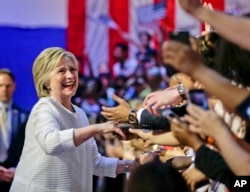 Democratic presidential candidate Hillary Clinton greets supporters during a rally on June 7, 2016. (AP)