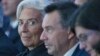 Managing Director of the International Monetary Fund Christine Lagarde, left, attends the plenary session of the World Economic Forum in Davos, Switzerland, Jan. 20, 2016. 