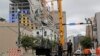 Las autoridades de Nueva Orleans dinamitarán dos enormes grúas dañadas que penden sobre una obra en construcción parcialmente derrumbada en el borde del Barrio Francés, anticipando una tormenta tropical que podría derribarlas de manera descontrolada.
