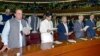 Incoming PM Nawaz Sharif (L) takes the oath of office with other newly-elected parliamentarians during the first session of the National Assembly in Islamabad, June 1, 2013.