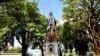 A vandalized statue of Christopher Columbus towers over Columbus Square in Port of Spain, Trinidad and Tobago, Aug. 28, 2024. 