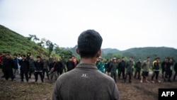 This photo taken on July 7, 2021 shows members of the Karenni People Defense Force (KPDF) taking part in military training at their camp near Demoso in Kayah state. - In their camp hidden in the forested hills of Kayah state near the Thai border, Myanmar. (Photo by STR / AFP) 