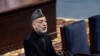 Afghan President Hamid Karzai speaks during the first day of the Loya Jirga in Kabul, Afghanistan, Nov. 21, 2013.
