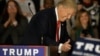 FILE - Republican presidential candidate Donald Trump smiles and gives a thumbs up as supporters applaud during a campaign rally Nov. 9, 2015, in Springfield, Illinois.