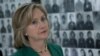 U.S. Secretary of State Hillary Rodham Clinton looks at a wall of faces of those killed by the Khmer Rouge regime, during a tour of the Tuol Sleng Genocide Museum, formerly the regime's notorious S-21 prison, on Monday, Nov. 1, 2010, in Phnom Penh, Cambo