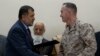 International Security Assistance Force (ISAF) commander General Joseph Dunford (r) and Afghan Defense Minister Bismillah Khan Mohammadi during a ceremony handing over the Bagram prison to Afghan authorities, at the U.S. airbase in Bagram, Mar 25, 2013.