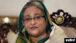 ঢাকায় এক সংবাদ সম্মেলনে কথা বলছেন প্রধানমন্ত্রী শেখ হাসিনা - ফাইল ফটো- রয়টার্স 