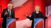 Democratic presidential candidate Senator Bernie Sanders listens to a point made by rival candidate Hillary Clinton during a presidential primary debate hosted by MSNBC in Durham, N.H., Feb. 4, 2016.
