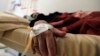 FILE - A Yemeni woman suspected of being infected with cholera receives treatment at a hospital in the capital Sanaa, July 24, 2018. 