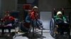 FILE - Children wait to be examined from Unicef health workers in Kafra Batna in the Damascus suburb of eastern Ghouta, Syria, Oct. 30, 2017. 