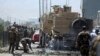 Afghanistan's security forces search the site of a suicide attack in Kabul, Afghanistan, Sunday, Aug. 10, 2014. 