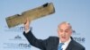 Israeli Prime Minister Benjamin Netanyahu holds up a remnant of what he said was a piece of Iranian drone which was shot down in Israeli airspace during his speech at the Munich Security Conference, Germany, Feb. 18, 2018. 