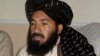 In this April, 20, 2007 photo, Pakistani militant commander Maulvi Nazir meets his associates in South Waziristan near the Afghan border.