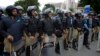 Pakistan Pakistani police officers surround the Supreme Court building Aug 2, 2013. Police are on alert against potential militant attacks in the capital, Islamabad. 