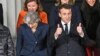 Prime Minister Theresa May (L) and French President Emmanuel Macron prepare for a group photo during UK-France summit talks at the Royal Military Academy Sandhurst, in Camberley, England, Jan. 18, 2018. 