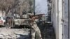 FILE - A member of Libyan National Army fires a weapon during clashes with Islamist militants in the militants' last stronghold in Benghazi, Libya, July 6, 2017.