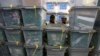 Afghan electoral workers sort ballot boxes at a counting center in Kabul, April 10, 2014. 