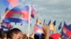 Cambodia students hold the Cambodian national flags as they attend the Independence Day celebration at the Independence Monument in the capital Phnom Penh.
