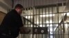 FILE - A security guard secures a gate at the medium security Maryland Correctional Institution in Hagerstown, Maryland. The U.S. Justice Department says it will provide life skills and job training for U.S. prisoners re-entering society.